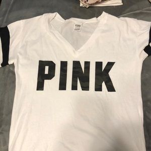 Pink tshirt, camo lettering